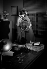 Man consoling a young woman in his office © stokkete