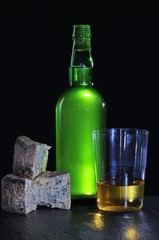Cider bottle with Cabrales cheese.