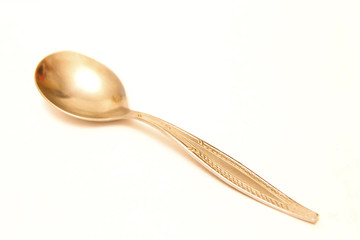Tea spoon laying isolated on the white background