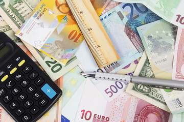 Background made of dollar, euro and calculator
