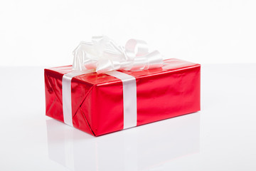 Red gift box with white bow for christmas