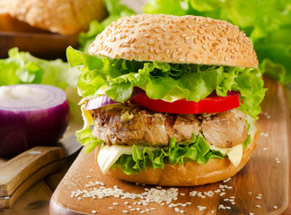 Homemade healthy hamburger with fresh vegetables.