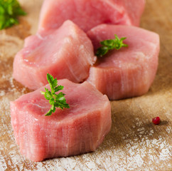 Raw beef with herbs on a cutting board