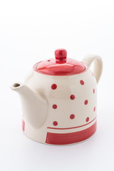 Polka dot tea pot isolated on white background