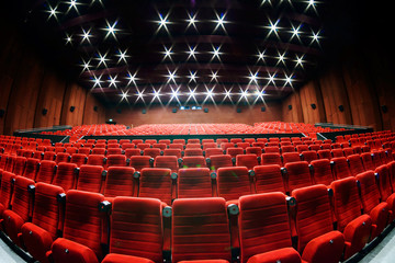 Empty movie theater with red seats