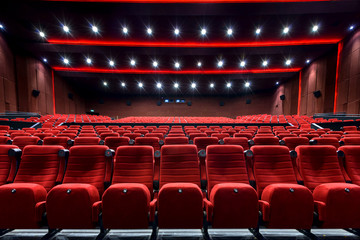 Empty movie theater with red seats