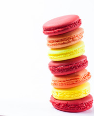Colorful macarons on white