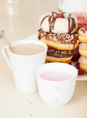 tasty donuts   with cups