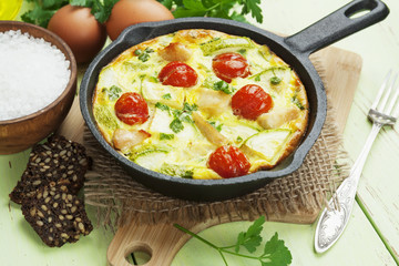 Zucchini baked with chicken, cherry tomatoes and herbs
