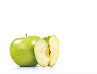 quarter of an apple next to a whole apple