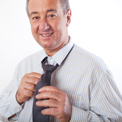 Businessman binds the tie