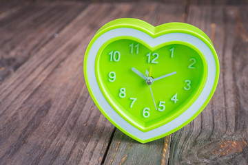 Clock on wood background