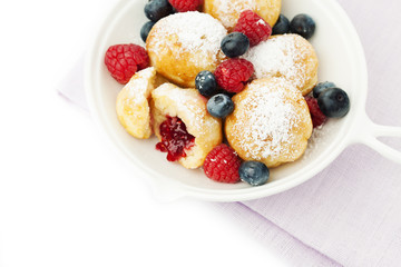 Traditional danish pancakes - ebelskivers with fresh berries
