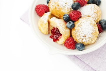 Traditional danish pancakes - ebelskivers with fresh berries