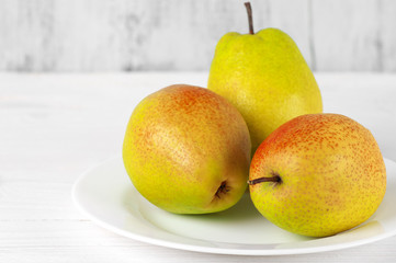 Pears on white wood