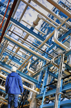 oil worker and large pipeline construction, powerful color.