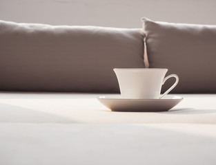 Coffee on sofa and pillow home interior