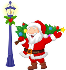 Santa carrying a Christmas tree