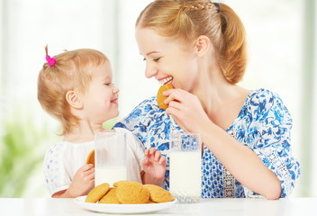 happy family mother and baby  girl at breakfast