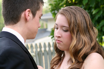 Intent Prom Girl Fixing Boutonniere