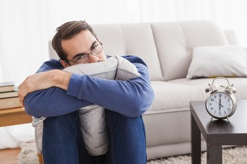 Depressed young man looking at camera