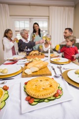 Smiling family toasting at christmas dinner