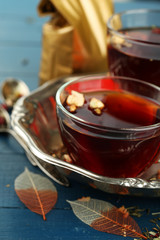 Beautiful vintage composition with herbal tea, on wooden table