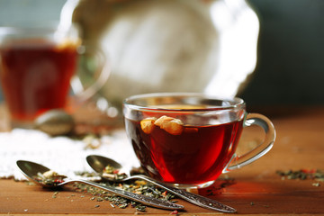 Beautiful vintage composition with herbal tea, on wooden table