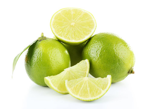 Fresh juicy limes isolated on white