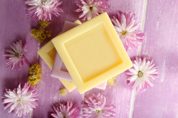 Bars of natural soap and fresh flowers