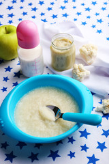 Fresh baby food in bowl with spoon