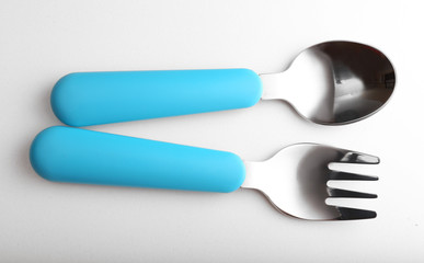 Blue baby cutlery isolated on white