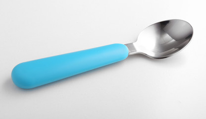 Blue baby spoon isolated on white