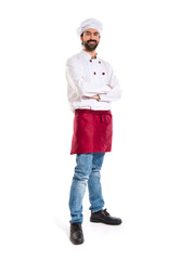 Chef with his arms crossed over white background