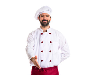 Chef making a deal over white background