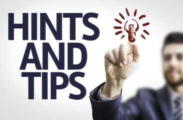 Business man pointing the text: Hints and Tips