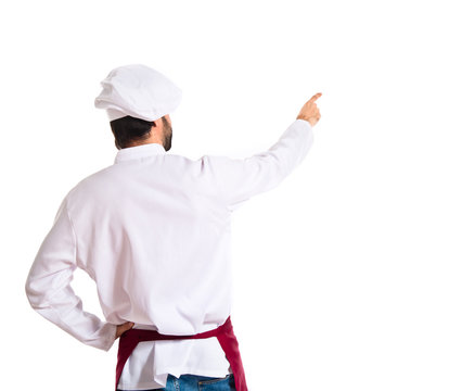 Chef Pointing Back Over White Background