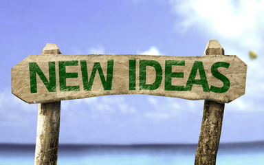 New Ideas sign with a beach on background