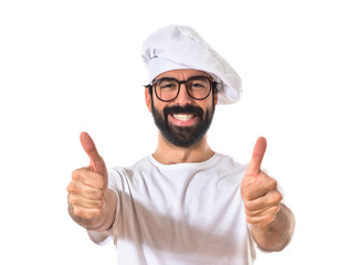 Chef with thumb up over white background