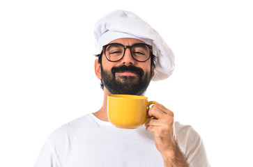 Chef holding a cup of coffee