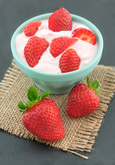 Fresh strawberry with yogurt in a glass
