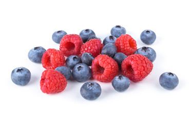 fresh raspberries and blueberries isolated on white background