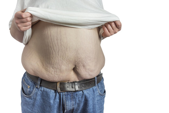 overweight Man in blue jeans lifting white shirt