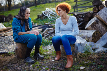 Mother and daughter talking outdoor