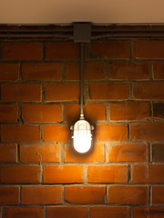 Fototapeta na wymiar Old brick wall with industrial light