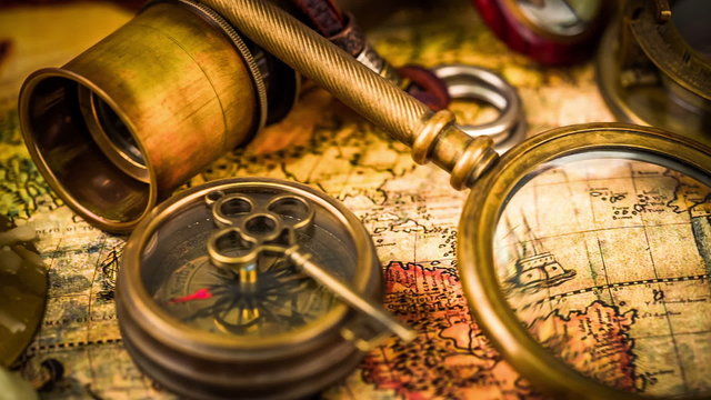 Vintage still life on ancient world map in 1565.