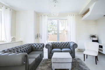 White living room with grey sofas