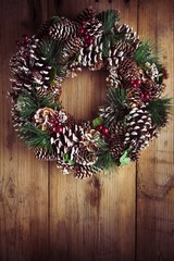 Christmas wreath on a rustic wooden door