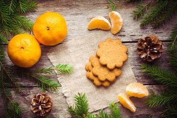 Gingerbread Cookie with mandarins on Christmas background