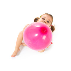 Kid playing with balloons over white background